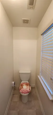 a bathroom with a toilet and a sink