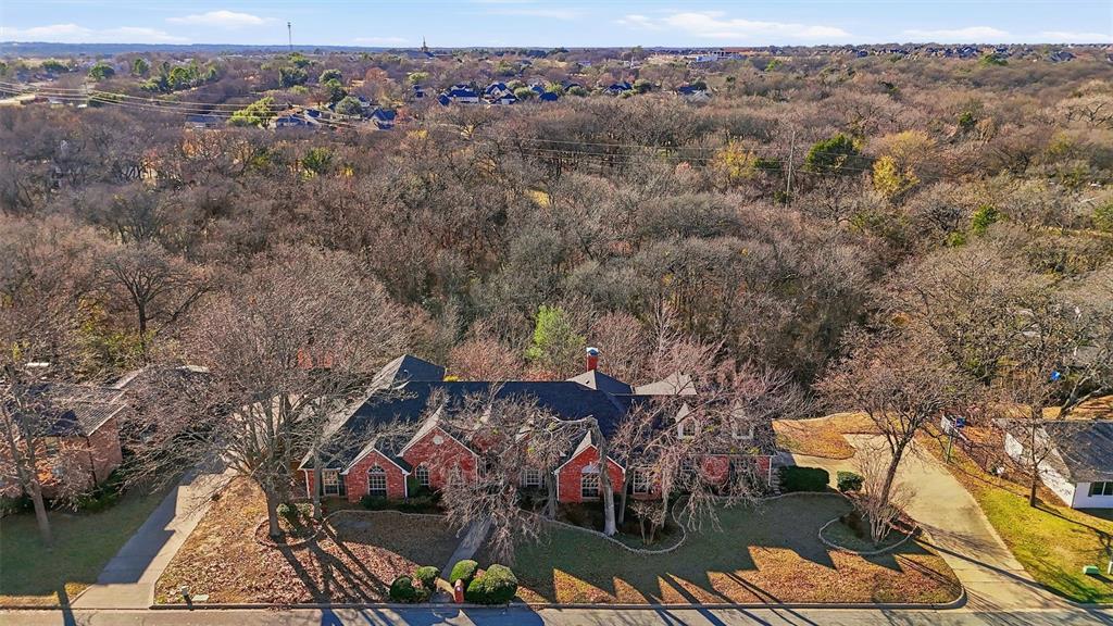 an aerial view of houses with yard