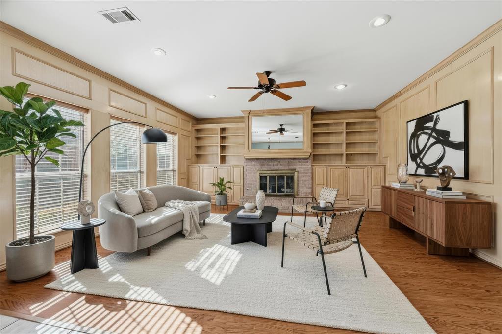 2210 Meadows Lane Sherman, TX 75092 - Photo 11 of 40 a living room with furniture and a fireplace