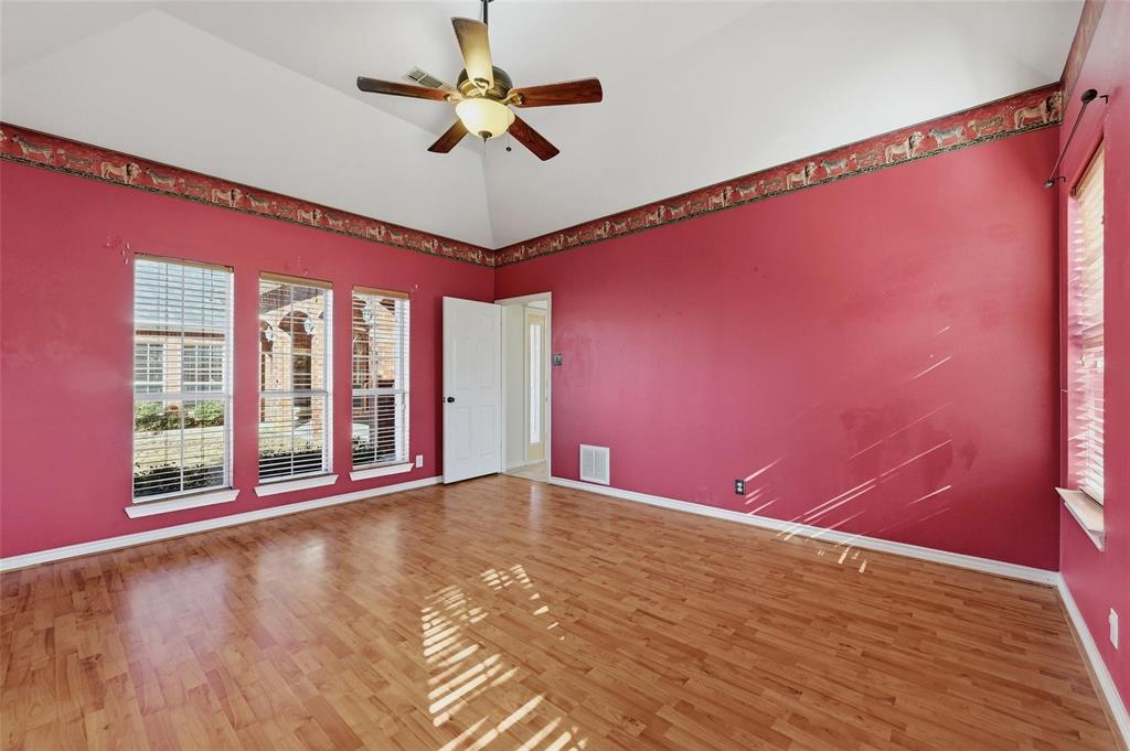 2210 Meadows Lane Sherman, TX 75092 - Photo 13 of 40 a view of an empty room with a window and a ceiling fan