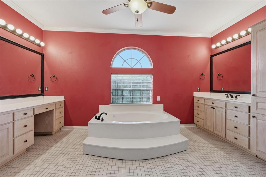 2210 Meadows Lane Sherman, TX 75092 - Photo 14 of 40 a spacious bedroom with a bed and a dresser