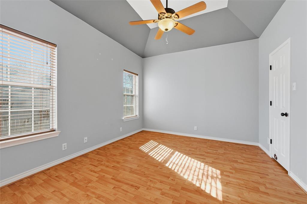 2210 Meadows Lane Sherman, TX 75092 - Photo 19 of 40 a view of a room with a ceiling fan and a window