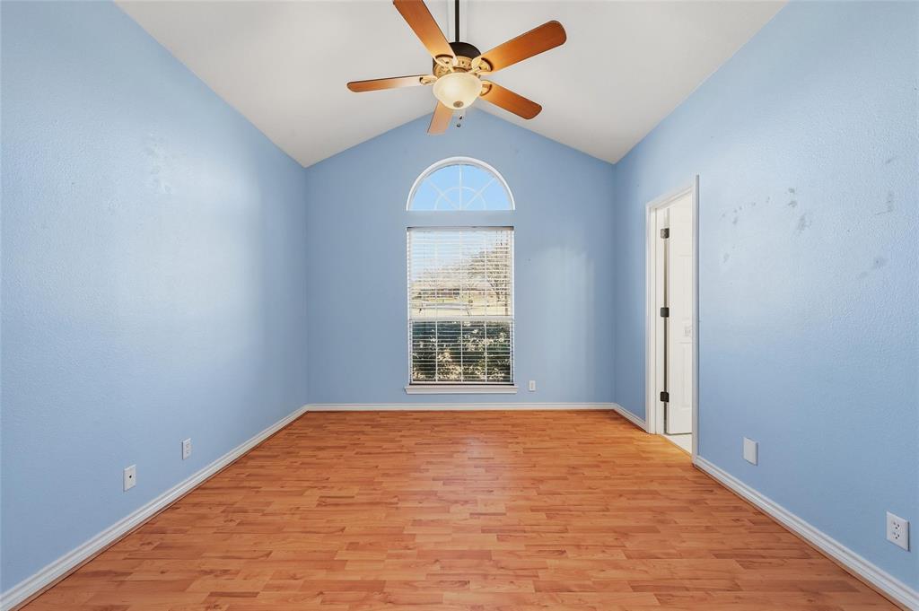 2210 Meadows Lane Sherman, TX 75092 - Photo 21 of 40 an empty room with windows and fan