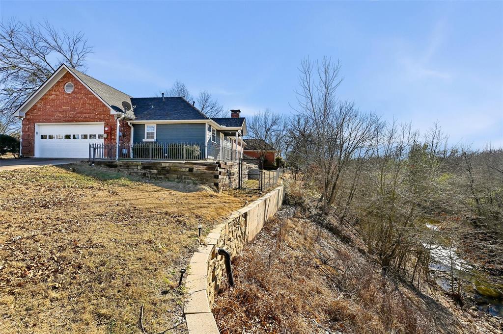2210 Meadows Lane Sherman, TX 75092 - Photo 29 of 40 a view of a house with a yard covered in snow