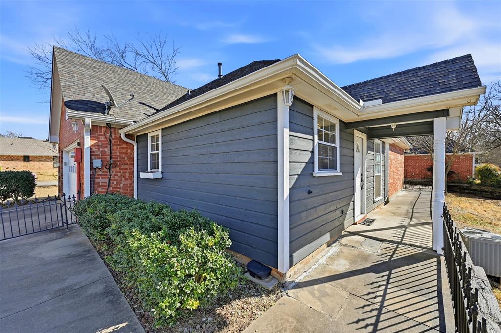 2210 Meadows Lane Sherman, TX 75092 - Photo 30 of 40 a front view of a house with garden