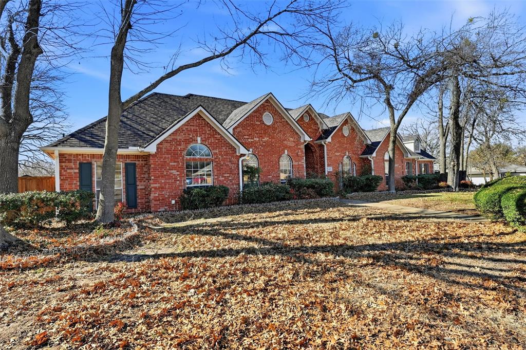 2210 Meadows Lane Sherman, TX 75092 - Photo 3 of 40 a front view of a house with a yard