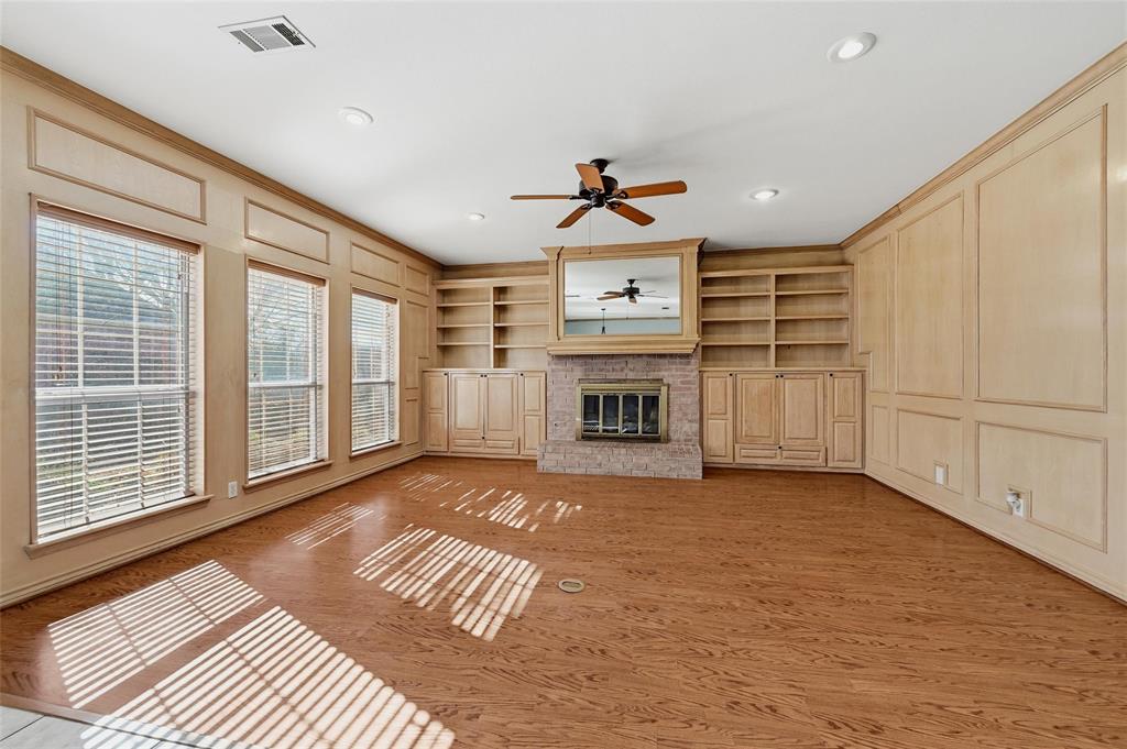 2210 Meadows Lane Sherman, TX 75092 - Photo 10 of 40 a view of an empty room with a fireplace and a window