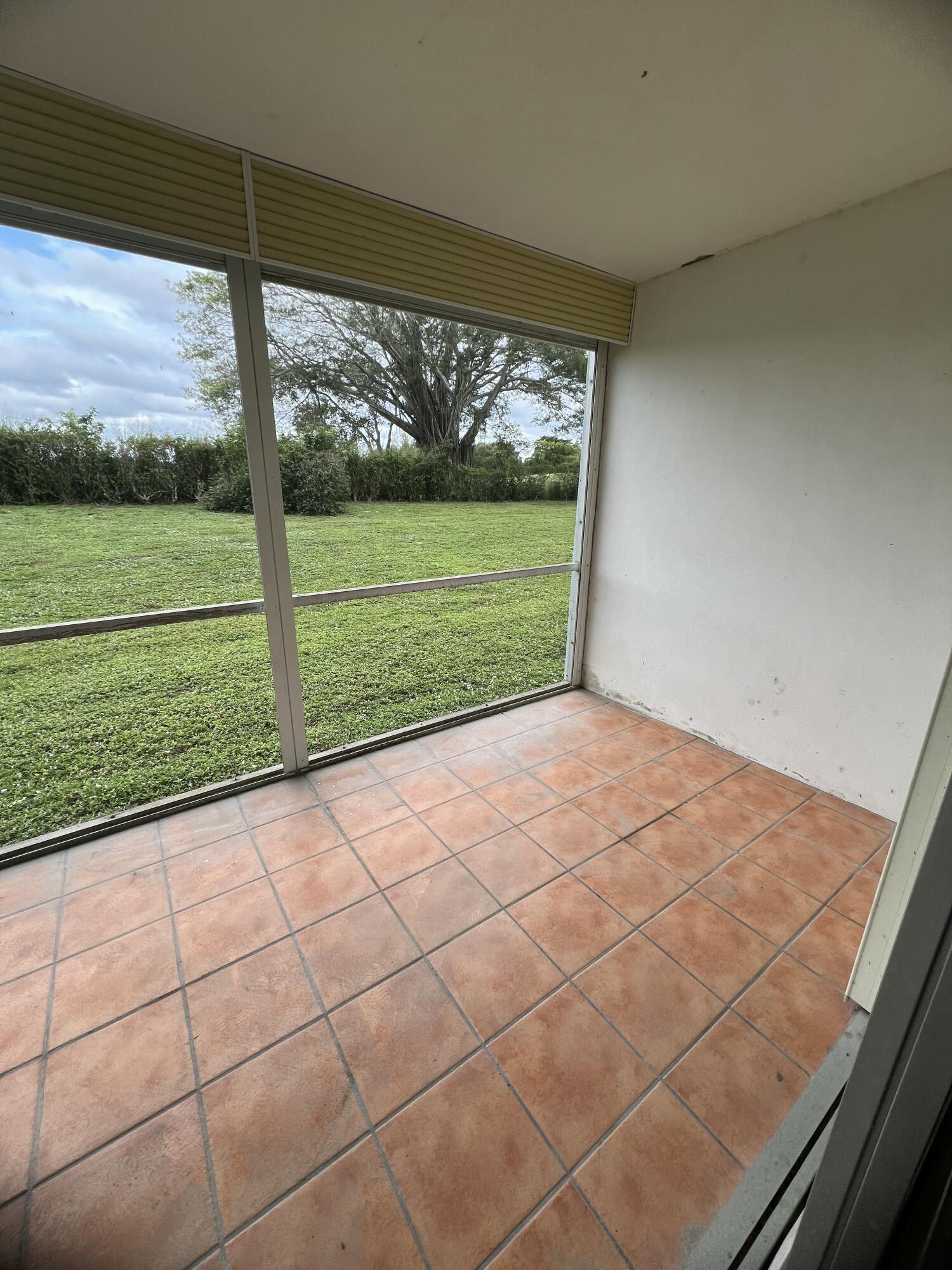 5500 Northwest 2nd Avenue, Unit 121 Boca Raton, FL 33487 - Photo 17 of 28 a view of a room with a big yard