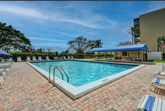 a view of a swimming pool with a patio