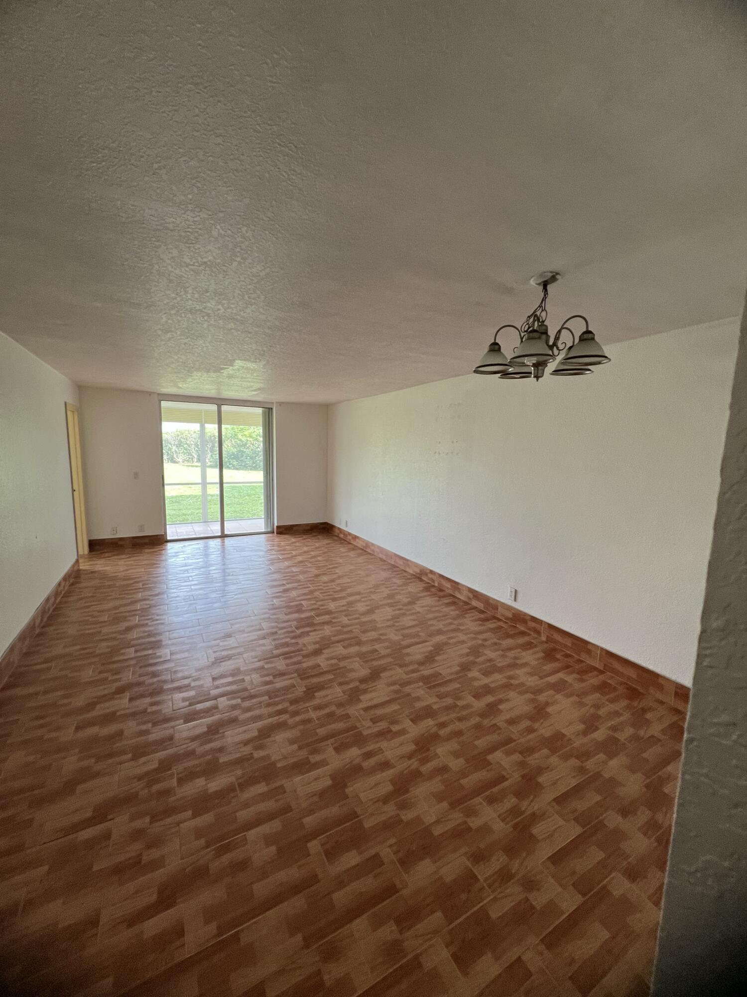5500 Northwest 2nd Avenue, Unit 121 Boca Raton, FL 33487 - Photo 8 of 28 wooden floor in an empty room with a window