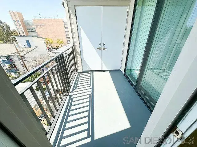 a view of a balcony with wooden floor