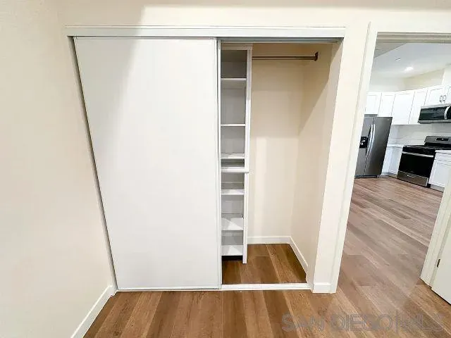 a view of a living room with a wooden floor