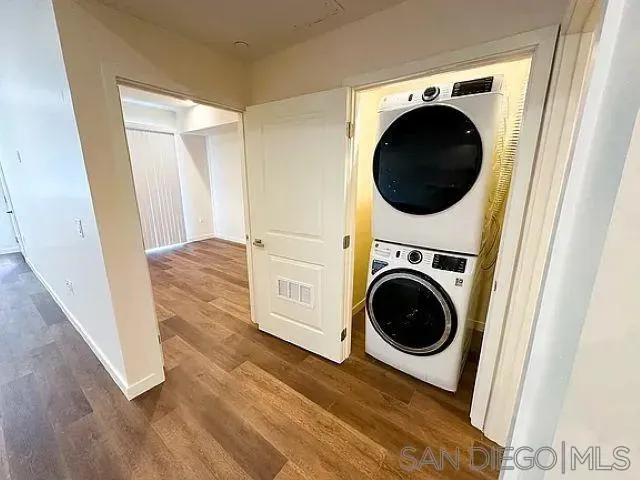 a view of a hallway with washer and dryer