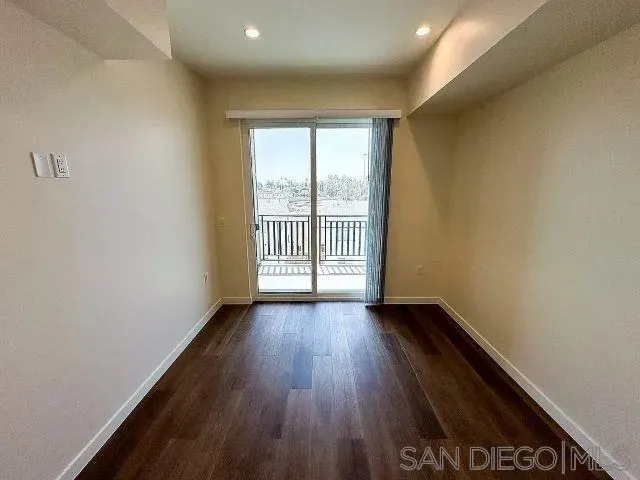 a view of a kitchen from the hallway