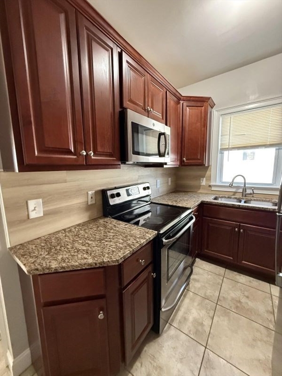 517 President Fall River, Unit 1 Fall River, MA 02720 - Photo 1 of 13 a kitchen with a sink stove top oven and microwave