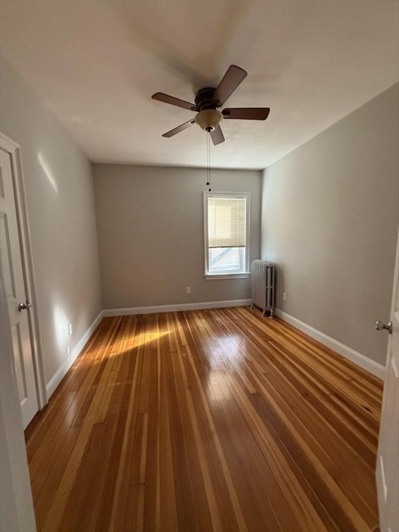 517 President Fall River, Unit 1 Fall River, MA 02720 - Photo 10 of 13 wooden floor in an empty room with a window