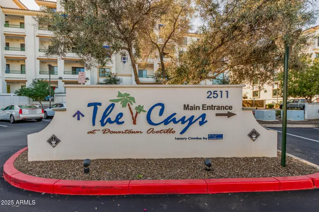 a view of a swimming pool with outdoor seating and plants