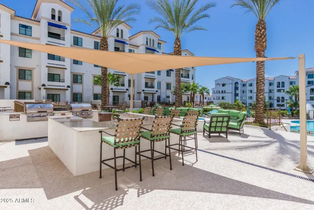 a view of a chairs and table in patio