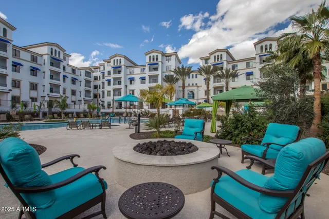 a front view of a house with outdoor seating