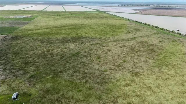 a view of a big yard with an empty space