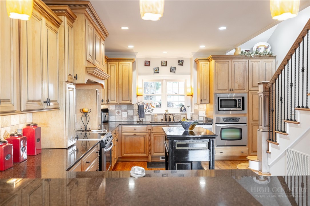 50 Mitchell River Ridge Thurmond, NC 28683 - Photo 13 of 43 a living room with furniture and a fireplace