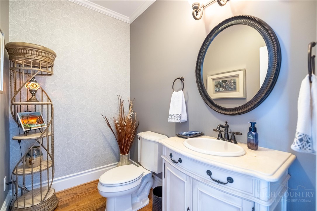 50 Mitchell River Ridge Thurmond, NC 28683 - Photo 16 of 43 a bathroom with a toilet a sink and a mirror