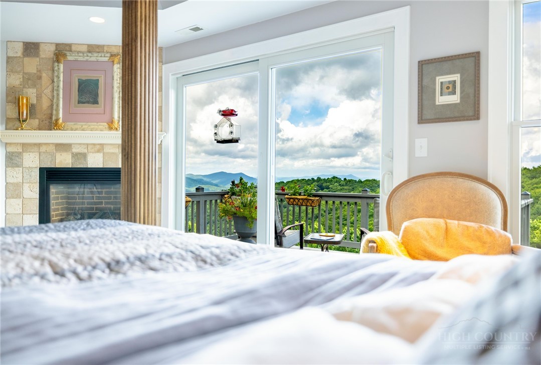 50 Mitchell River Ridge Thurmond, NC 28683 - Photo 20 of 43 a bedroom with a bed and a painting on the wall