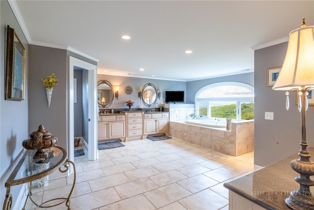 50 Mitchell River Ridge Thurmond, NC 28683 - Photo 29 of 43 a view of open kitchen with stainless steel appliances kitchen island granite countertop a refrigerator and stove top oven with a dishwasher