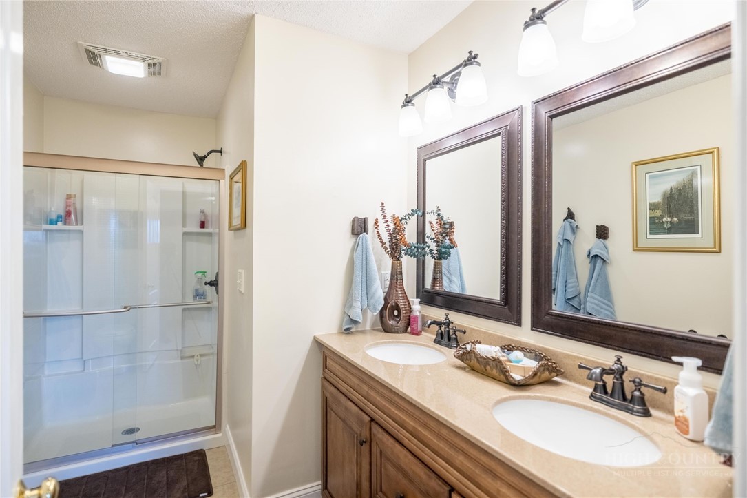 50 Mitchell River Ridge Thurmond, NC 28683 - Photo 31 of 43 a bathroom with a double vanity sink mirror and shower