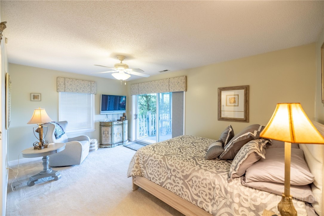 50 Mitchell River Ridge Thurmond, NC 28683 - Photo 32 of 43 a bedroom with a bed couch chandelier and window