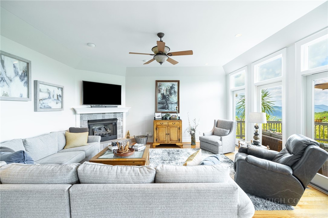 50 Mitchell River Ridge Thurmond, NC 28683 - Photo 6 of 43 a living room with furniture a flat screen tv and a large window