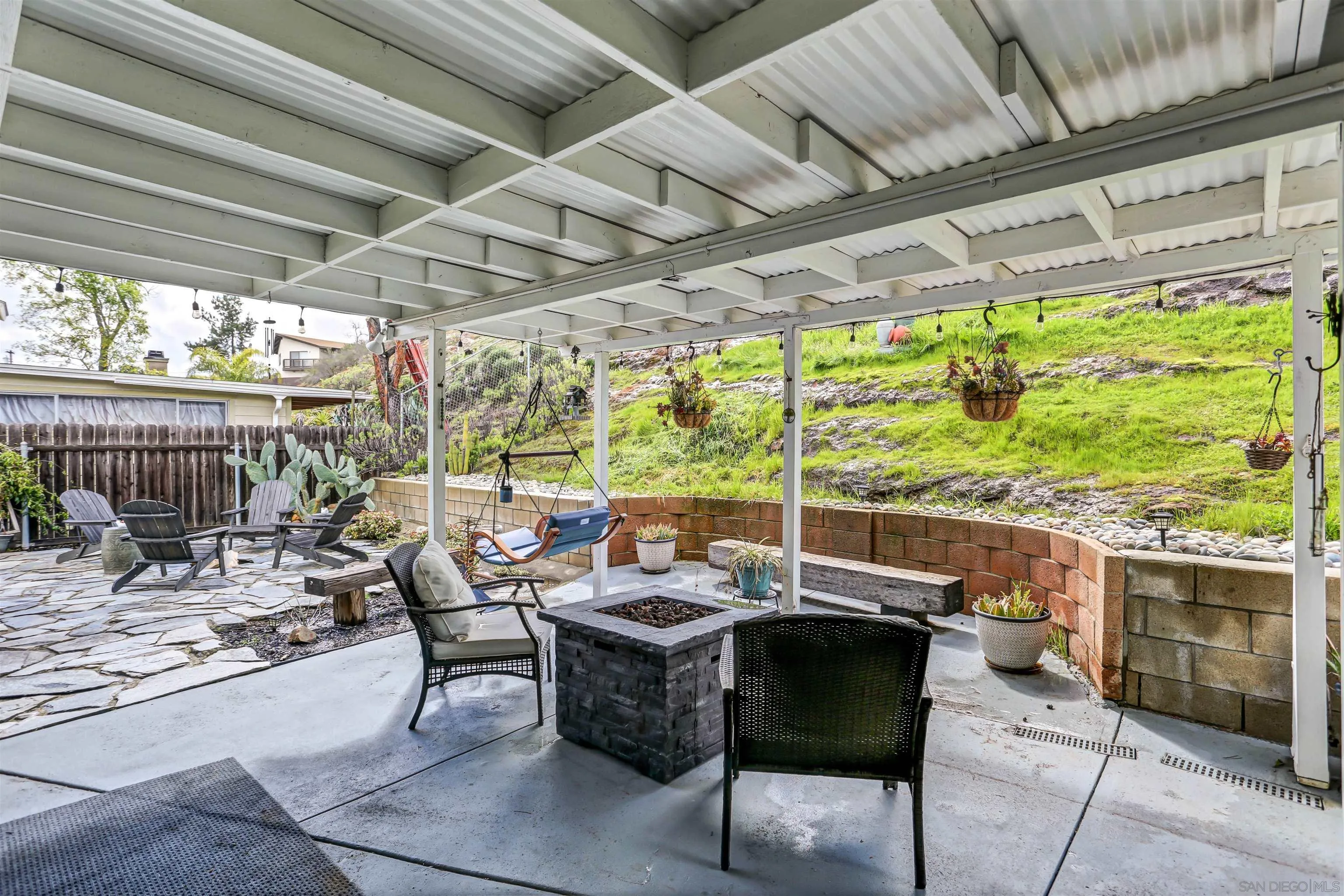 8009 Shantung Drive Santee, CA 92071 - Photo 11 of 39 a view of a patio with table and chairs and potted plants