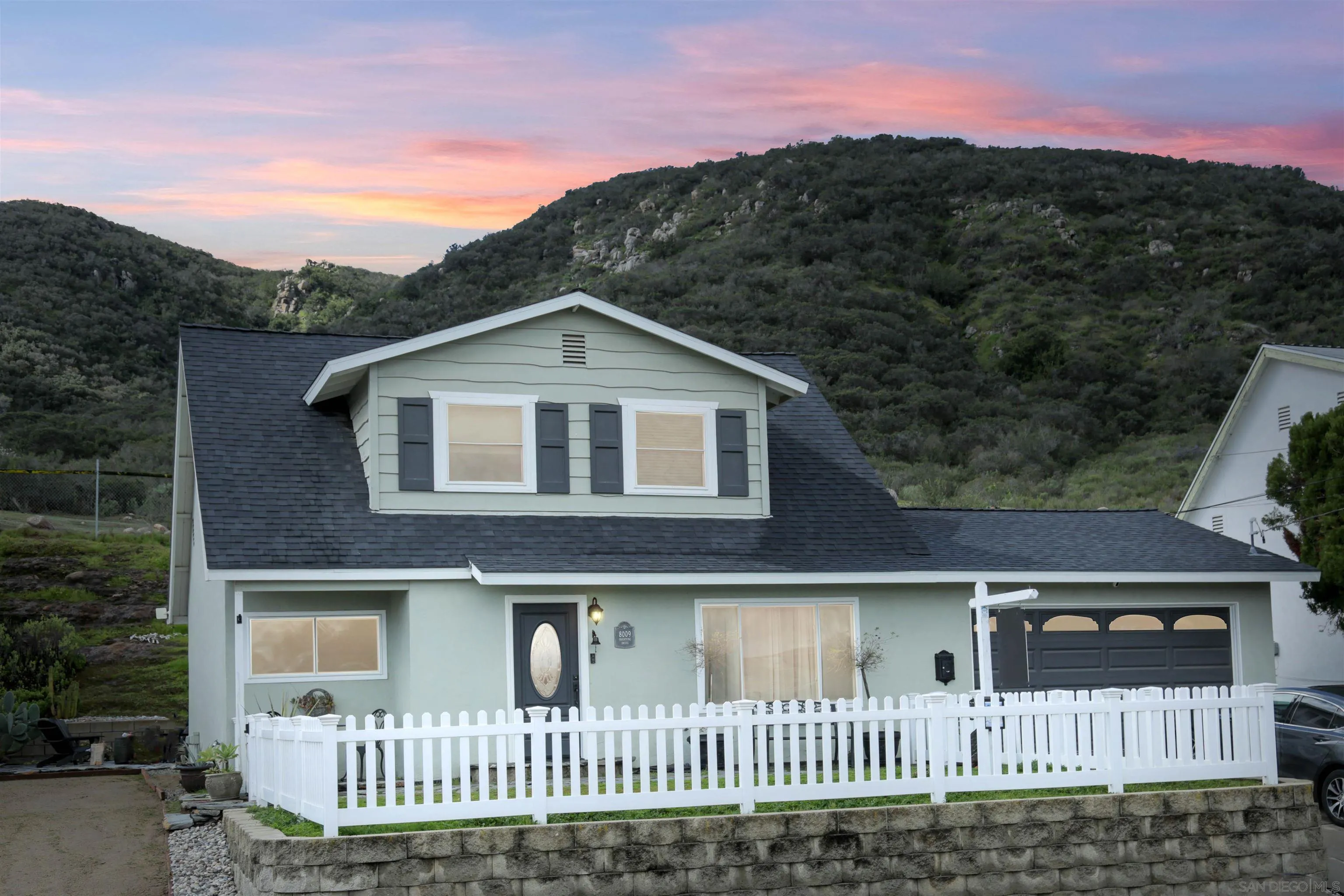 8009 Shantung Drive Santee, CA 92071 - Photo 12 of 39 a front view of a house with a yard