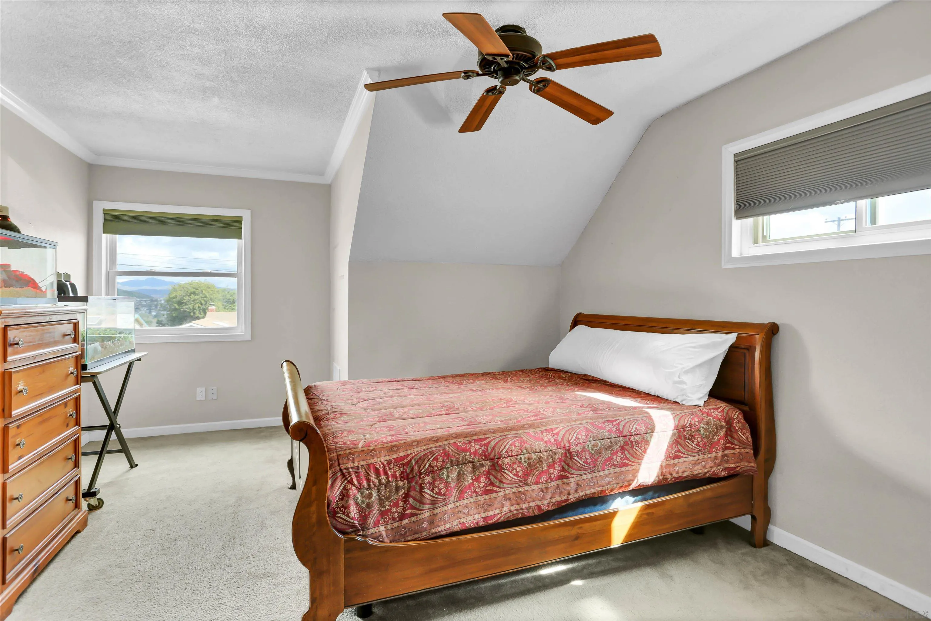 8009 Shantung Drive Santee, CA 92071 - Photo 14 of 39 a bedroom with a bed a chandelier and a window