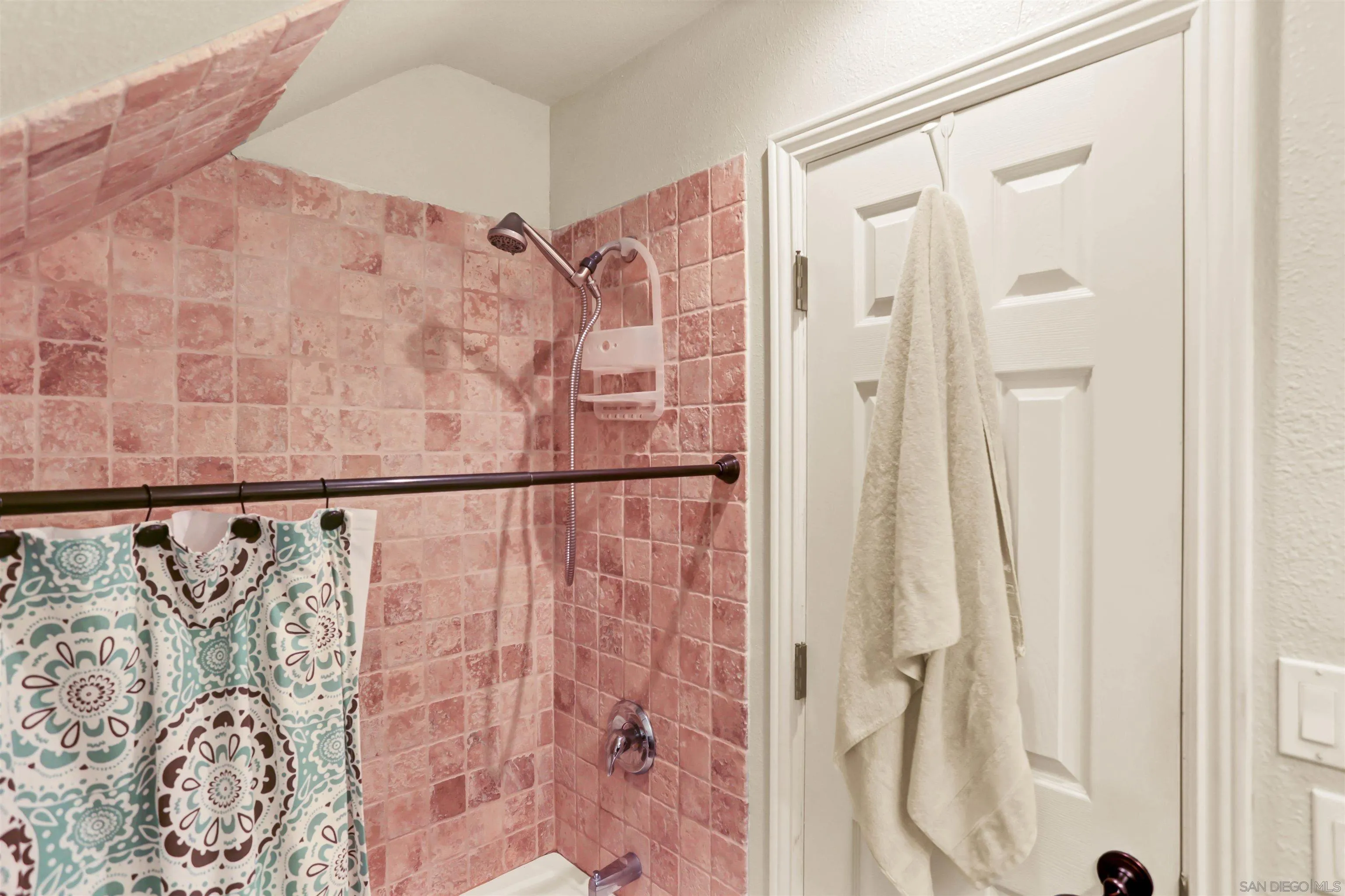 8009 Shantung Drive Santee, CA 92071 - Photo 16 of 39 a bathroom with a shower curtain and a shower curtain