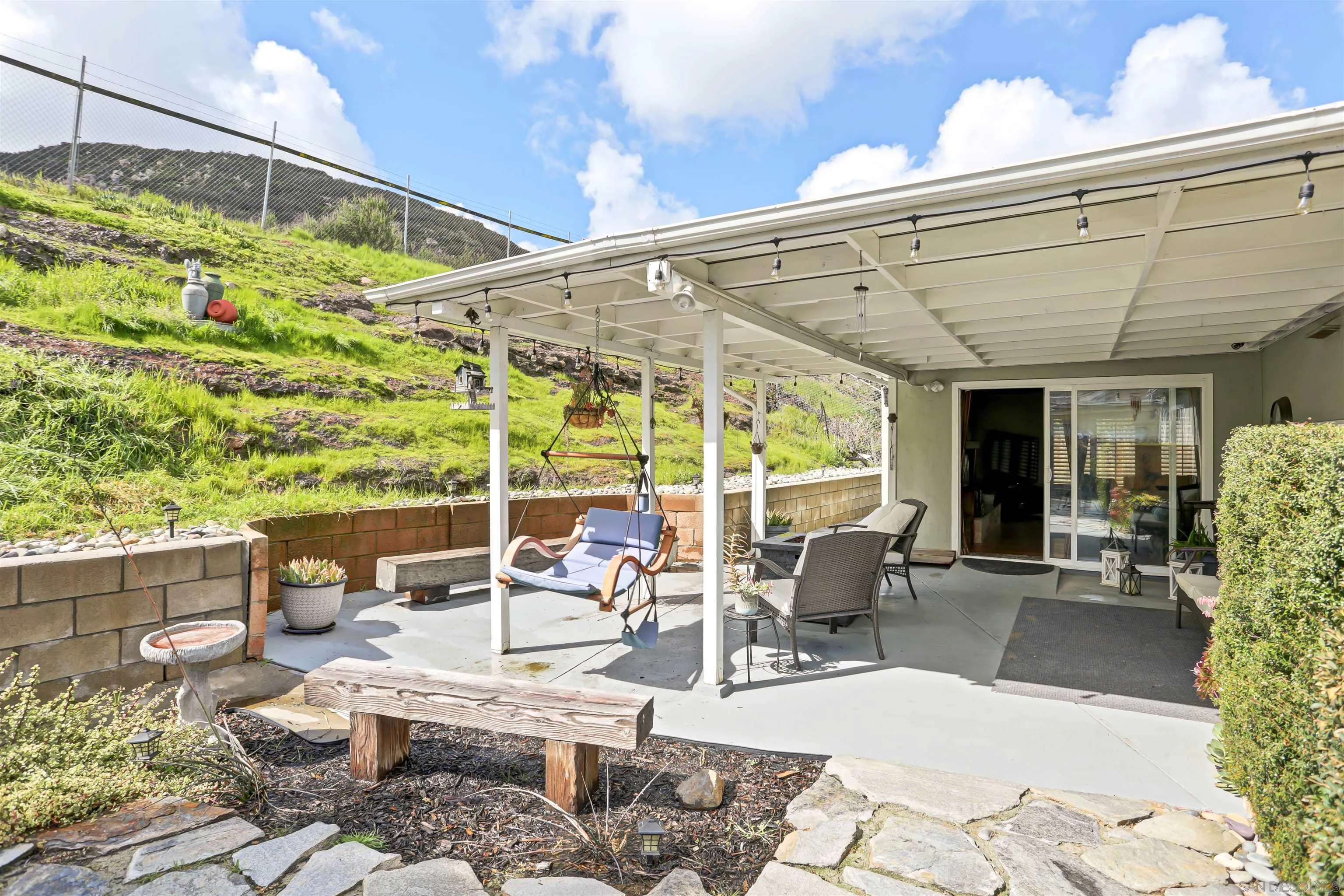 8009 Shantung Drive Santee, CA 92071 - Photo 22 of 39 a building outdoor space with patio furniture and potted plants