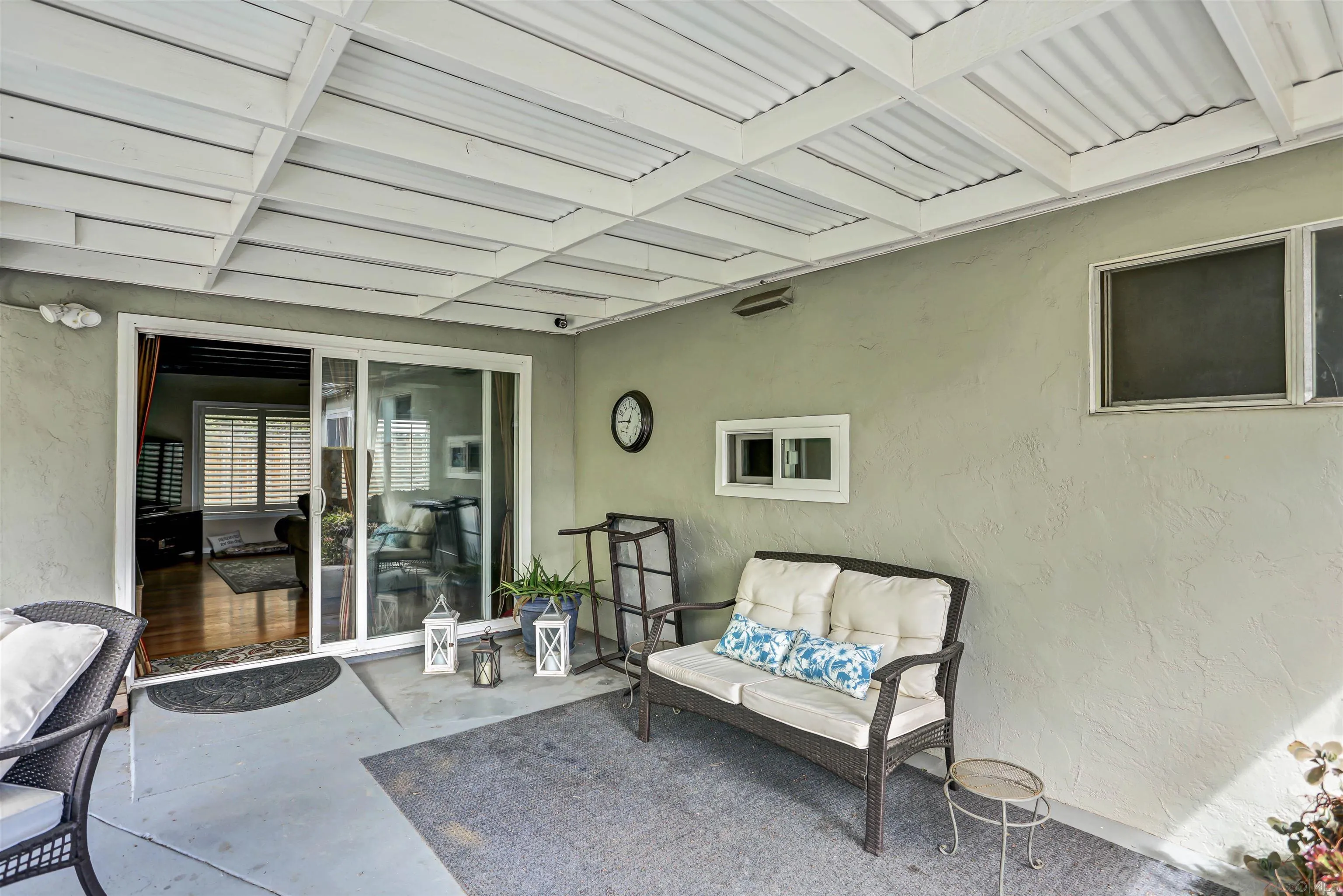 8009 Shantung Drive Santee, CA 92071 - Photo 23 of 39 a living room with furniture and a flat screen tv