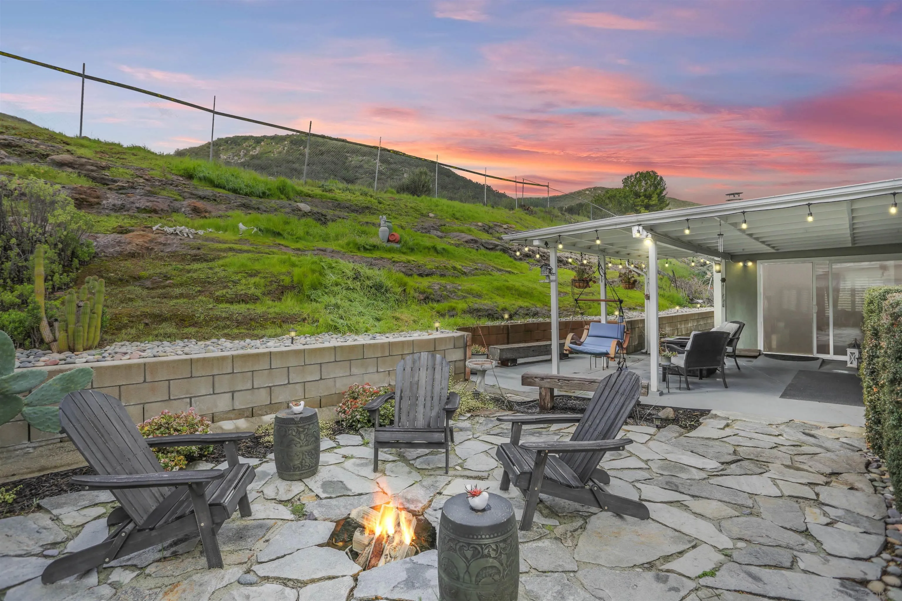 8009 Shantung Drive Santee, CA 92071 - Photo 26 of 39 a view of a patio with table and chairs and potted plants