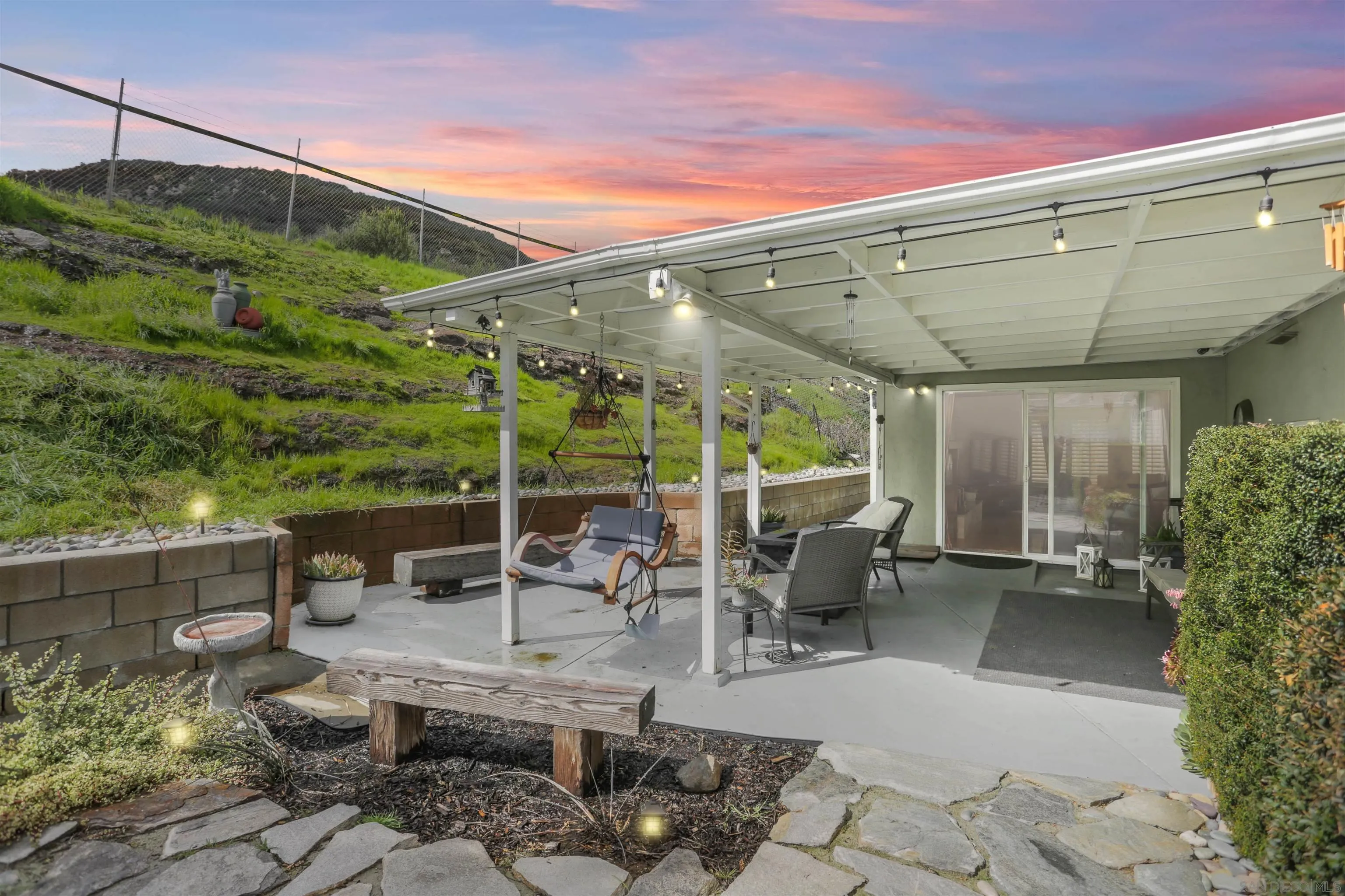 8009 Shantung Drive Santee, CA 92071 - Photo 27 of 39 a view of a patio with couches chairs and potted plants