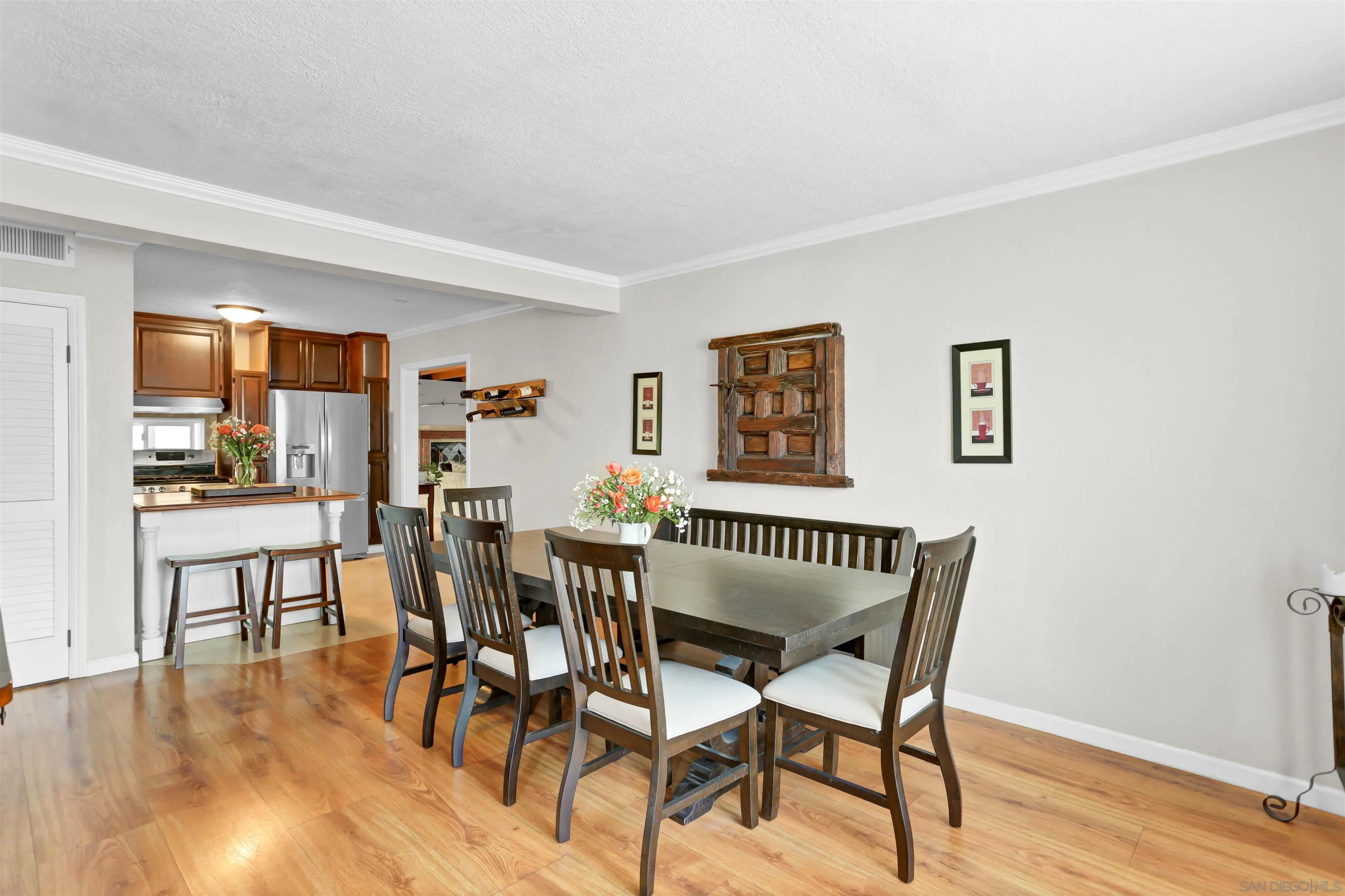 8009 Shantung Drive Santee, CA 92071 - Photo 3 of 39 a view of a dining room with furniture and wooden floor