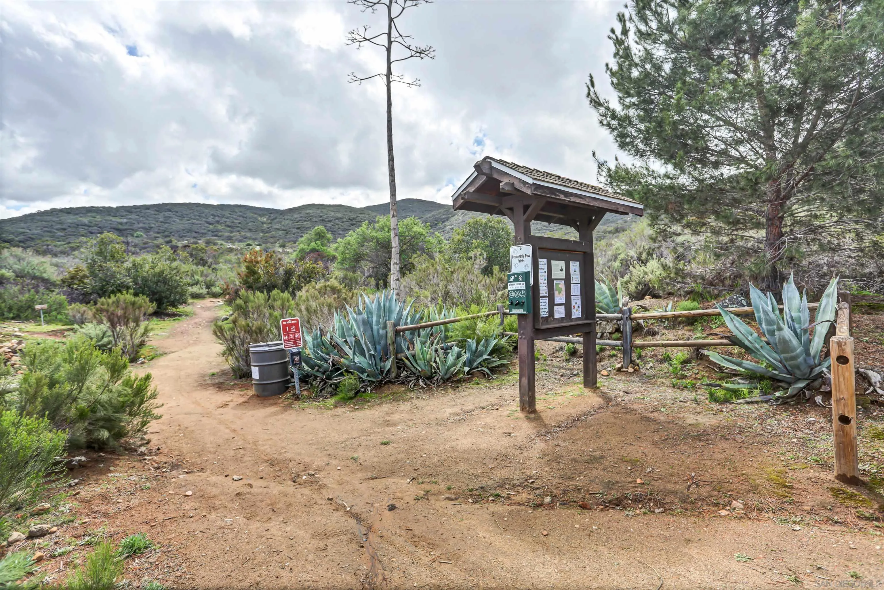 8009 Shantung Drive Santee, CA 92071 - Photo 36 of 39 a backyard of a house with barbeque oven table and chairs