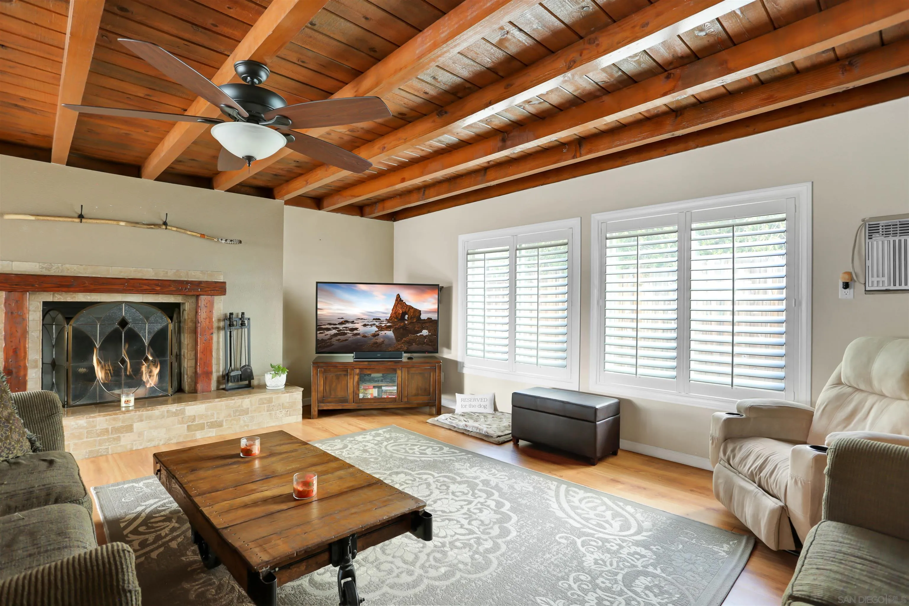 8009 Shantung Drive Santee, CA 92071 - Photo 8 of 39 a living room with furniture a flat screen tv and a large window