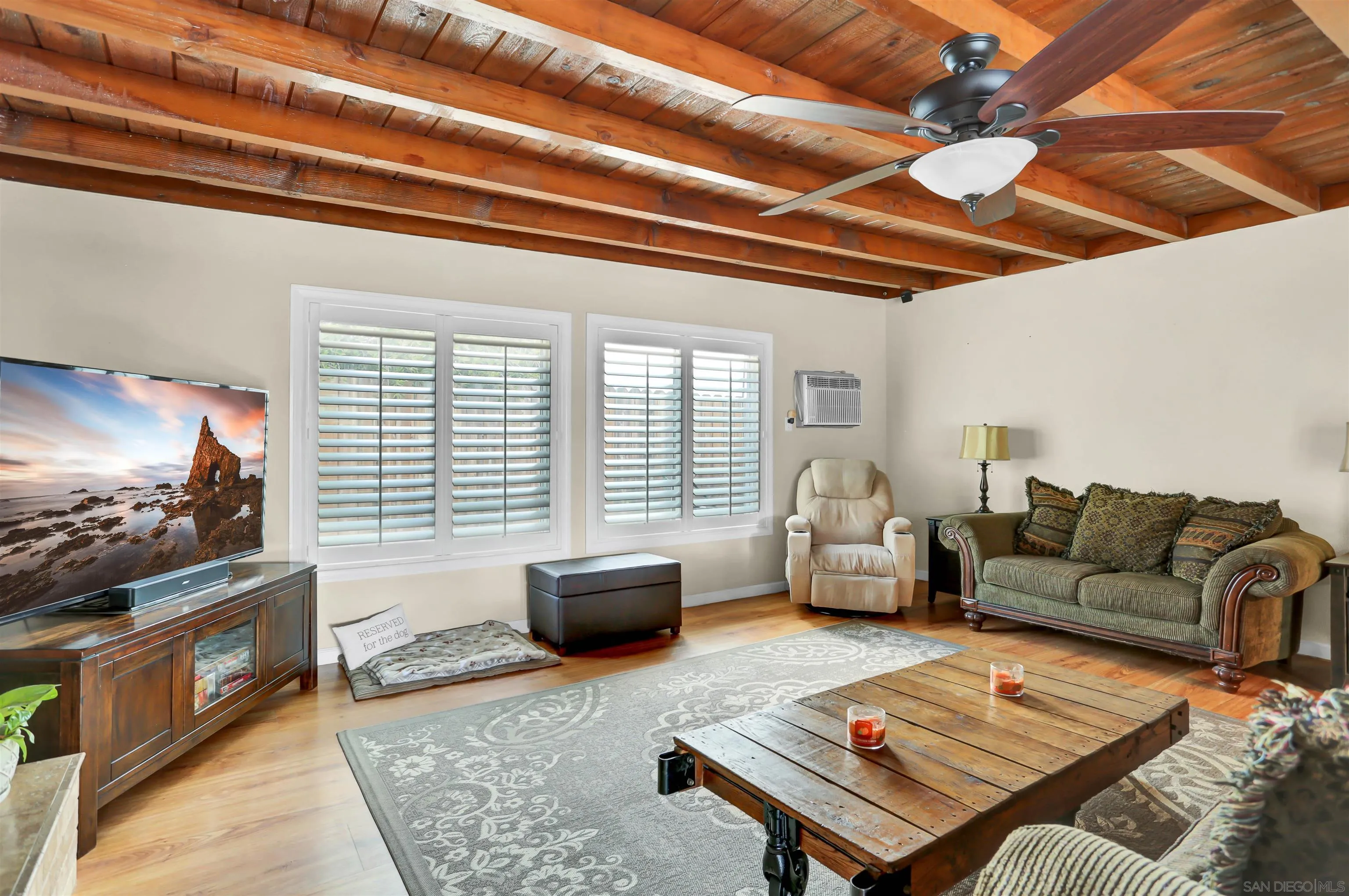 8009 Shantung Drive Santee, CA 92071 - Photo 9 of 39 a living room with furniture and a flat screen tv