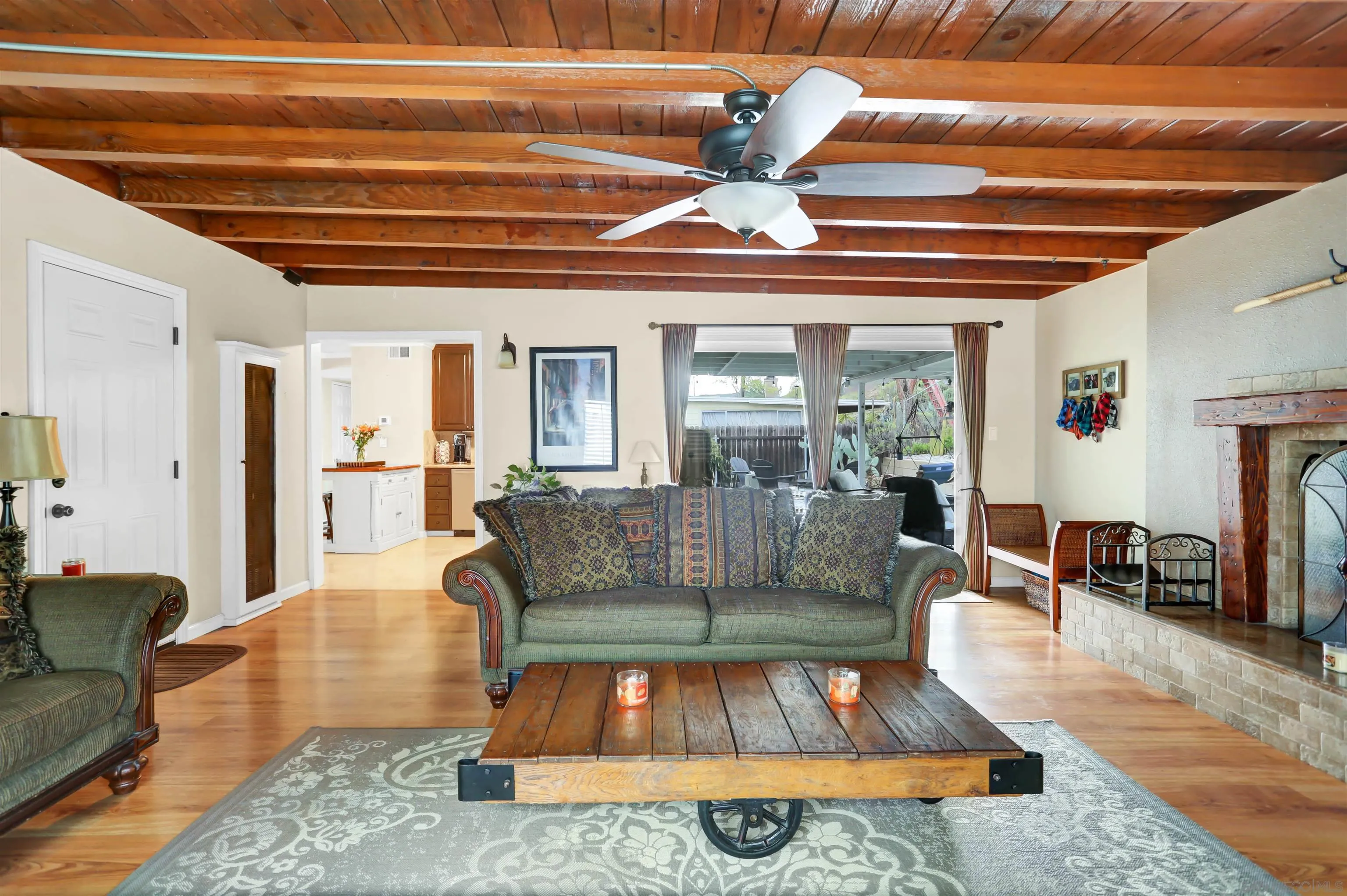 8009 Shantung Drive Santee, CA 92071 - Photo 10 of 39 a living room with furniture and a chandelier