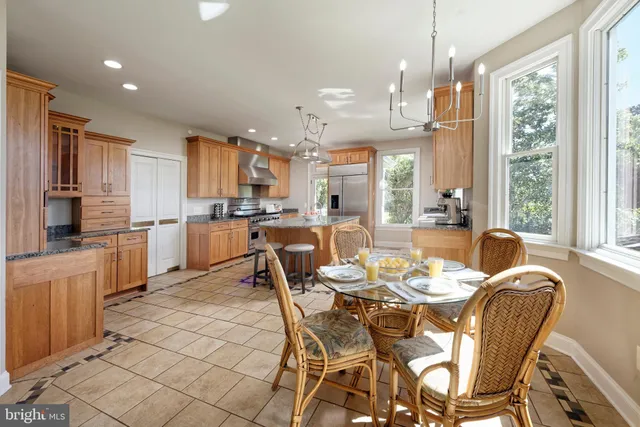 a living room with furniture a piano a rug and a window