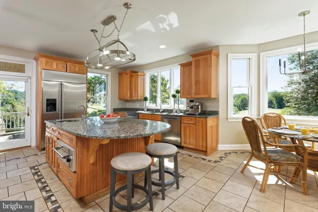 a living room with furniture a window and a lamp