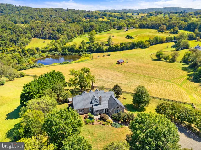 a kitchen with granite countertop wooden cabinets and a sink