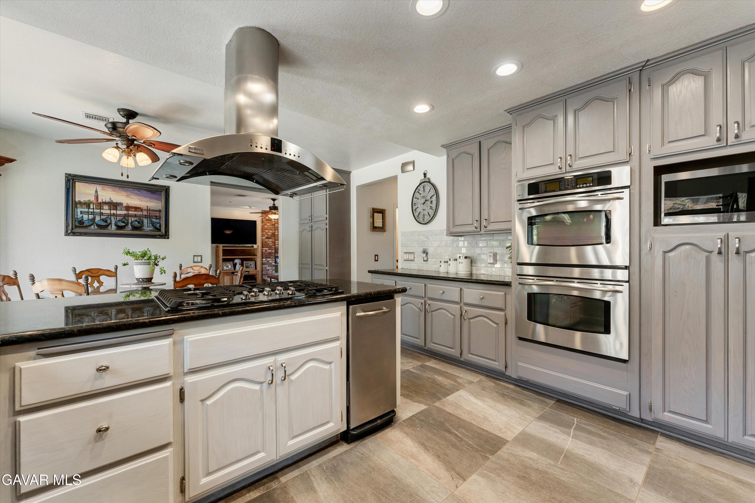 34625 Red Rover Mine Road Acton, CA 93510 - Photo 13 of 66 a kitchen with granite countertop a sink stainless steel appliances and cabinets