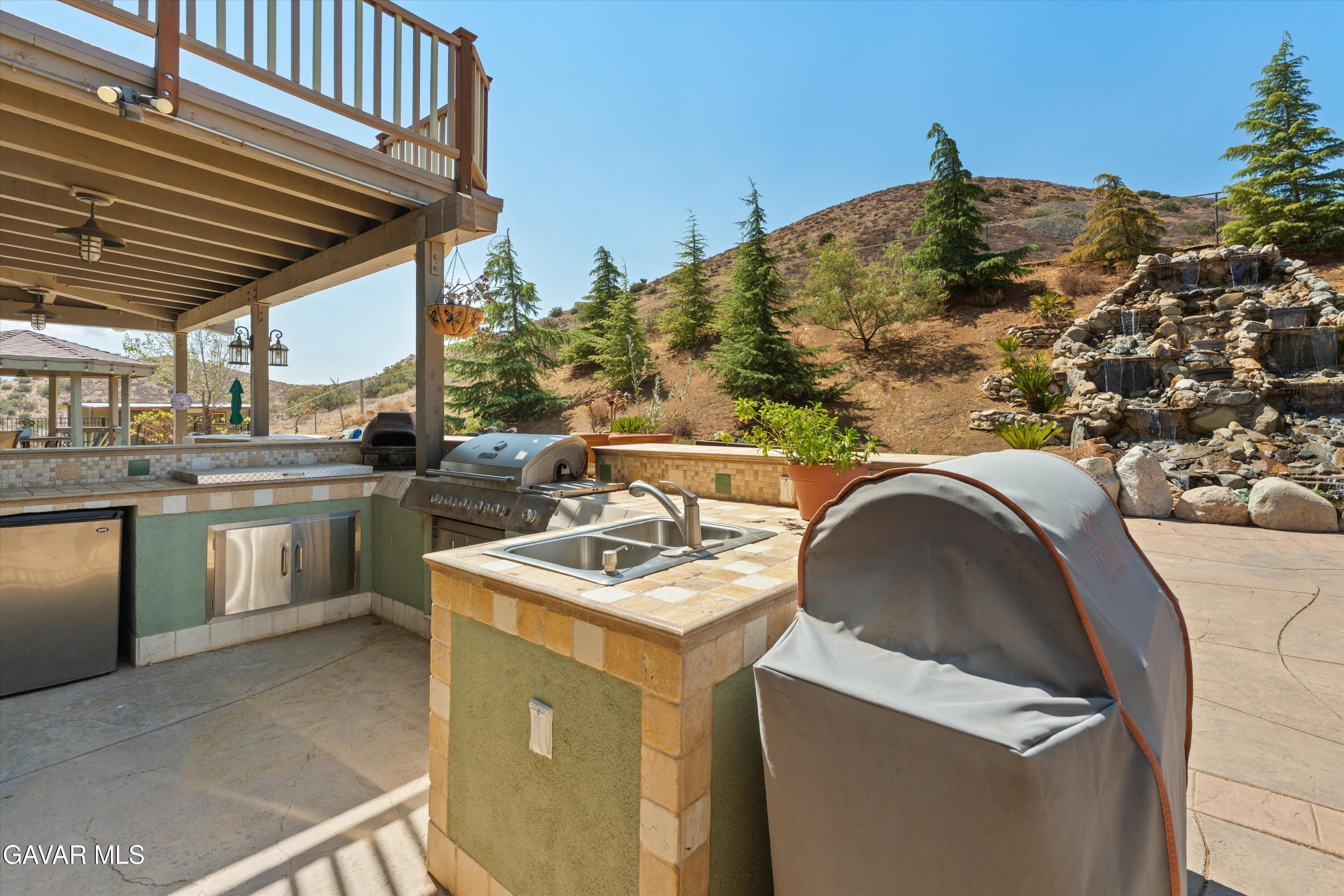 34625 Red Rover Mine Road Acton, CA 93510 - Photo 15 of 66 a utility room with a sink a washer and dryer