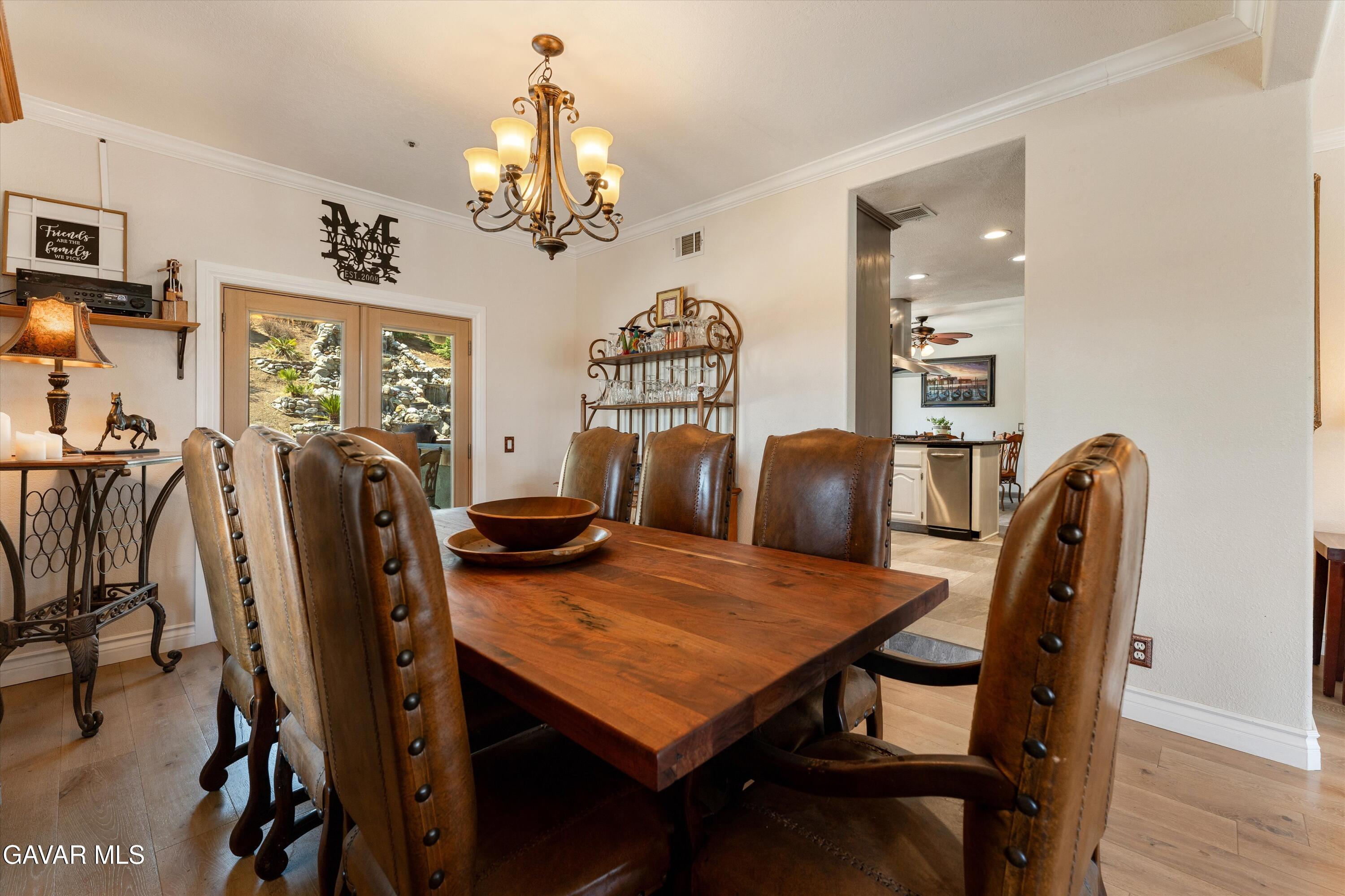 34625 Red Rover Mine Road Acton, CA 93510 - Photo 21 of 66 a view of a dining room with furniture window and wooden floor